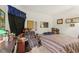 Bedroom with double bed, desk, and ample storage at 11537 Jagged Rock Ct, Fishers, IN 46037