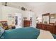 Main bedroom with teal bedding, dresser, and rocking chair at 11537 Jagged Rock Ct, Fishers, IN 46037