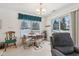 Bright dining area with a table and chairs, overlooking a tranquil view at 11537 Jagged Rock Ct, Fishers, IN 46037