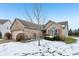 Brick ranch home with attached garage and snow-covered front yard at 11537 Jagged Rock Ct, Fishers, IN 46037