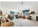 Large living room with vaulted ceiling, comfortable seating, and a fireplace at 11537 Jagged Rock Ct, Fishers, IN 46037