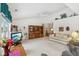 Spacious living room with vaulted ceiling, comfortable seating, and built-in shelving at 11537 Jagged Rock Ct, Fishers, IN 46037