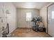 Small laundry room with plumbing and a window at 1302 Laurel St, Indianapolis, IN 46203