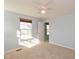 Well-lit bedroom featuring a large window and ceiling fan at 15256 Harmon Pl, Noblesville, IN 46060