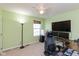 Bedroom with a home office setup and green walls at 15256 Harmon Pl, Noblesville, IN 46060