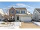Two-story brick and beige house with a green door and attached garage at 15256 Harmon Pl, Noblesville, IN 46060