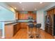 Kitchen with wood cabinets, stainless steel appliances, and an island at 15256 Harmon Pl, Noblesville, IN 46060
