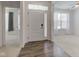 Bright entryway featuring wood floors, white front door with glass and adjacent living spaces at 15759 Hargray Dr, Noblesville, IN 46062