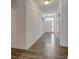 Bright hallway with light-colored walls, hardwood floors and a white front door at 15759 Hargray Dr, Noblesville, IN 46062