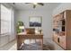Bright home office features a light wood desk, bookcase and neutral decor at 15759 Hargray Dr, Noblesville, IN 46062