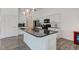 Kitchen with granite island, stainless steel appliances, and modern pendant lighting at 15759 Hargray Dr, Noblesville, IN 46062