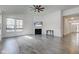 Spacious living room featuring vaulted ceilings, a fireplace, large windows, and modern flooring at 15759 Hargray Dr, Noblesville, IN 46062