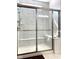 Modern tiled shower featuring a built-in bench seat and glass enclosure at 15759 Hargray Dr, Noblesville, IN 46062