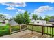 Wooden deck overlooking the backyard with a view of the neighborhood at 207 E Ohio St, Fortville, IN 46040