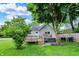 Backyard oasis complete with a wooden deck and secluded hot tub, perfect for outdoor living at 207 E Ohio St, Fortville, IN 46040