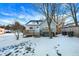 House backyard with deck, hot tub, and snowy landscape at 207 E Ohio St, Fortville, IN 46040