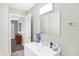 Clean bathroom with white vanity, mirror, and shower at 207 E Ohio St, Fortville, IN 46040