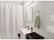 Simple bathroom with white vanity, mirror and shower at 207 E Ohio St, Fortville, IN 46040