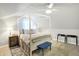 Large bedroom with a canopy bed and ceiling fan at 207 E Ohio St, Fortville, IN 46040