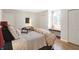 Comfortable bedroom with a queen bed and hardwood floors at 207 E Ohio St, Fortville, IN 46040