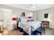 Bright bedroom with a queen bed and access to a bathroom at 207 E Ohio St, Fortville, IN 46040