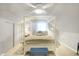 Bright bedroom with a four-poster bed and plenty of closet space at 207 E Ohio St, Fortville, IN 46040