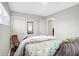 Serene bedroom with a queen bed and floral bedding at 207 E Ohio St, Fortville, IN 46040