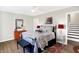 Spacious bedroom with a queen bed and hardwood floors at 207 E Ohio St, Fortville, IN 46040