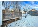 Wooden deck overlooks a snow-covered backyard at 207 E Ohio St, Fortville, IN 46040