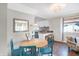 Small dining area with round table and teal chairs at 207 E Ohio St, Fortville, IN 46040