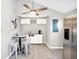 Charming dining area with a round table and white cabinets at 207 E Ohio St, Fortville, IN 46040