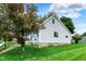 Charming home featuring well-manicured lawn and classic architecture with blue trim detail at 207 E Ohio St, Fortville, IN 46040