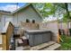 Enclosed hot tub area with privacy fencing and brick paver flooring for a relaxing outdoor experience at 207 E Ohio St, Fortville, IN 46040