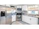 Modern kitchen with stainless steel appliances and white cabinets at 207 E Ohio St, Fortville, IN 46040