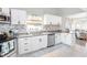 Bright kitchen featuring white cabinets and granite countertops at 207 E Ohio St, Fortville, IN 46040