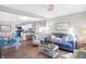 Bright living room with comfy seating, open to kitchen at 207 E Ohio St, Fortville, IN 46040