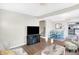Open living space with TV, fireplace, and dining area at 207 E Ohio St, Fortville, IN 46040