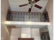 Open balcony overlooking the living room with decorative railing at 208 Winding Dr, Alexandria, IN 46001