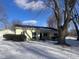 Ranch home with attached garage and mature trees in the front yard at 208 Winding Dr, Alexandria, IN 46001
