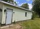 Side of the garage showing siding, window, and entry door at 208 Winding Dr, Alexandria, IN 46001