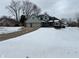 Two-story house with three-car garage and snow covered lawn at 245 Myerwood Dr, Danville, IN 46122