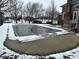 Inground pool with a winter pool cover in the backyard at 245 Myerwood Dr, Danville, IN 46122