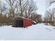 Two rustic outbuildings in a snowy, wooded setting at 2584 W Mercer Ln, Pendleton, IN 46064