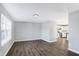 Open concept living room with kitchen view and dark gray vinyl flooring at 2911 Braxton Ct, Indianapolis, IN 46229