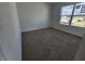 A bright bedroom featuring new carpet, large window, and neutral walls at 3231 W Keepsake Ln, Monrovia, IN 46157