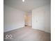 A carpeted bedroom has two doors and a flush mount ceiling light at 3231 W Keepsake Ln, Monrovia, IN 46157