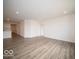 An expansive open-concept living space features durable floors and recessed lighting at 3231 W Keepsake Ln, Monrovia, IN 46157