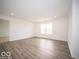 Open concept living area with durable flooring and a view to the exterior at 3231 W Keepsake Ln, Monrovia, IN 46157