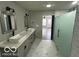 Updated bathroom with double vanity and glass shower at 334 Hamilton Ave, Indianapolis, IN 46201