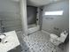Main bathroom with a tub, shower, and patterned floor tiles at 334 Hamilton Ave, Indianapolis, IN 46201
